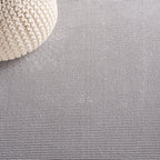 SAFAVIEH Revive Avie Solid Rug